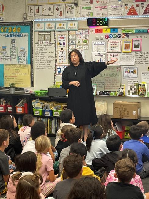Judge before a classroom of students